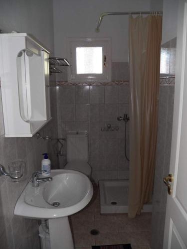 a bathroom with a sink and a toilet at Villa Marina in Ipsos