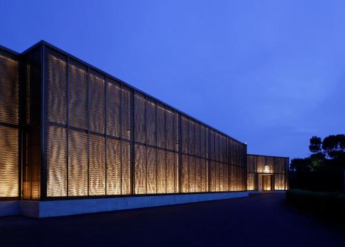 a large building with lights on it at night at THE HIRAMATSU HOTELS & RESORTS KASHIKOJIMA in Shima