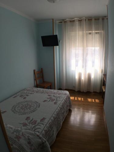 Cama o camas de una habitación en Hostal ** EC León