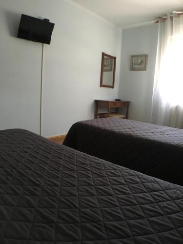 Cama o camas de una habitación en Hostal ** EC León