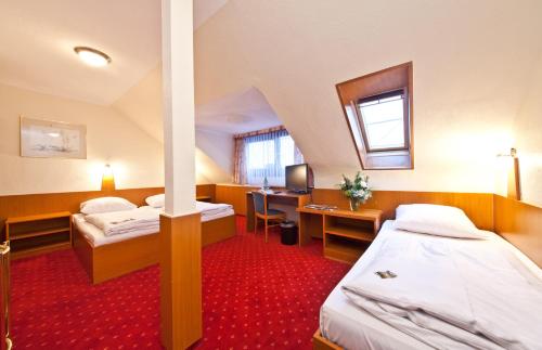 Säng eller sängar i ett rum på Hotel Primus Frankfurt Sachsenhausen