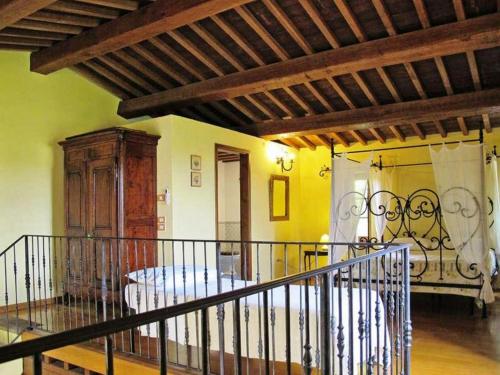 a living room with a staircase in a house at Podere Caldaruccio La Pineta in Bosco