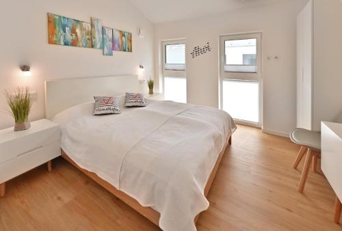 Letto o letti in una camera di Heimathafen am Boddenmarkt