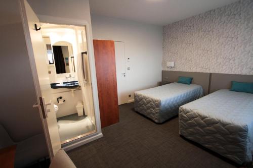 Ein Bett oder Betten in einem Zimmer der Unterkunft Centre Jean Bosco