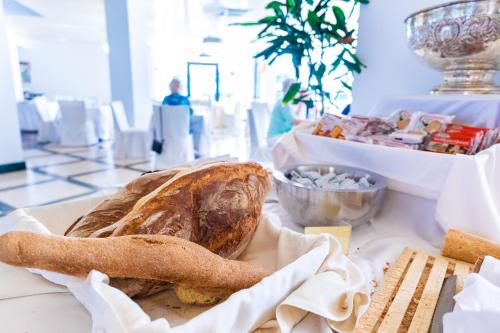 a loaf of bread sitting on top of a table at Cefalù Sea Palace in Cefalù