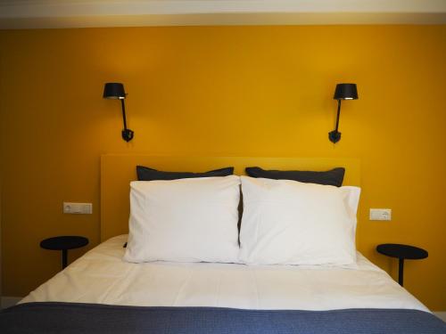Cama o camas de una habitación en Lino City Hotel
