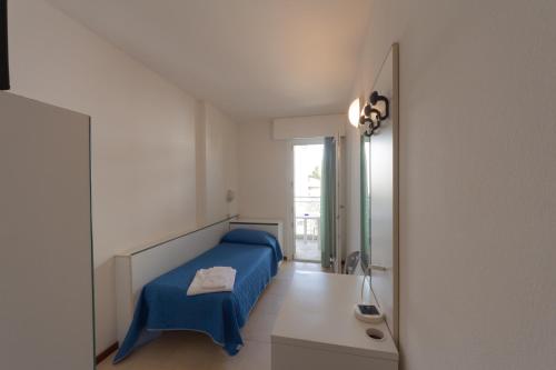 Postel nebo postele na pokoji v ubytování Hotel Ambra