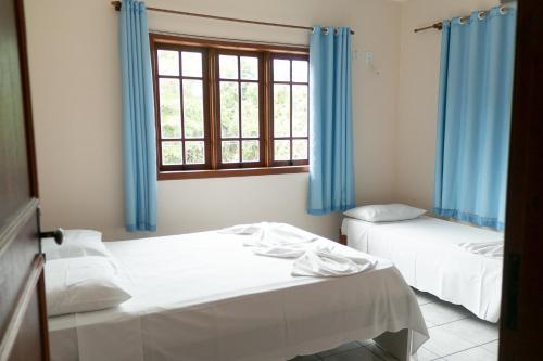 Un pat sau paturi într-o cameră la Mestre Lord Apart Hotel