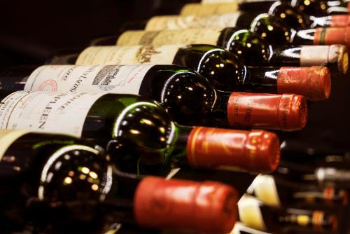 a bunch of wine bottles lined up in a row at Hotel Nassauer Hof in Wiesbaden