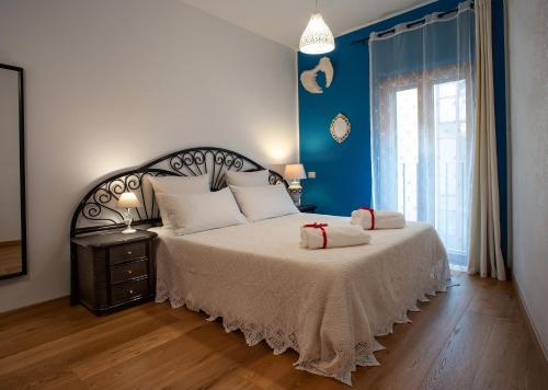 Tempat tidur dalam kamar di B&B Buonfiglio Cicconcelli - Terrazza panoramica