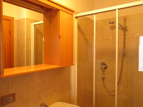 a bathroom with a shower and a toilet at Baita al Pian in Bormio