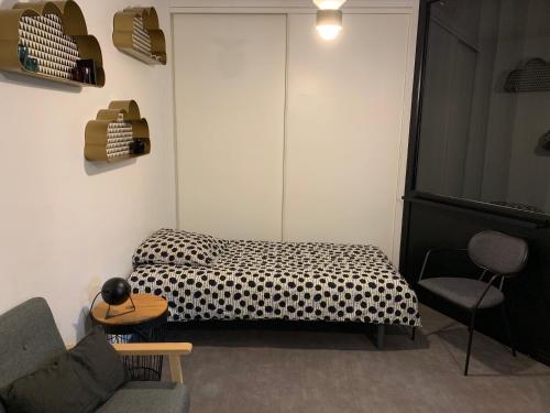 Ένα ή περισσότερα κρεβάτια σε δωμάτιο στο L'Atelier