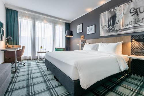 Postel nebo postele na pokoji v ubytování Radisson Blu Hotel Hannover