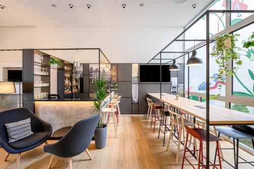 a kitchen with a dining room table and chairs at B&B HOTEL Brussels Centre Gare du Midi in Brussels