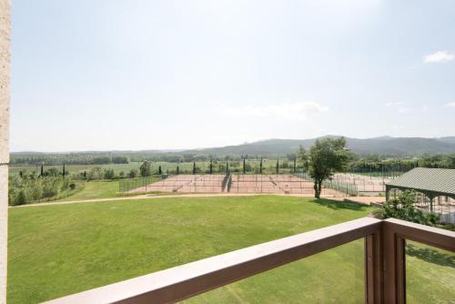a view of a baseball field from a balcony at Hotel Mas Solà in Santa Coloma de Farners