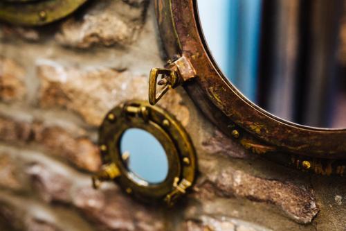 a close up of a mirror on a wall at Quite Simply French in Lancaster