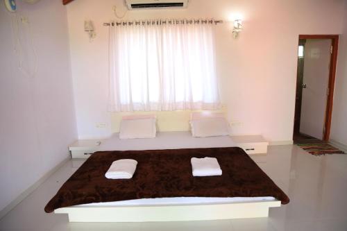 A bed or beds in a room at Rann Resort Dholavira