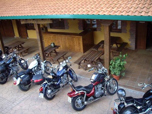 a group of motorcycles parked outside of a building at Posada La Vieja Escuela in San Roque de Ríomiera