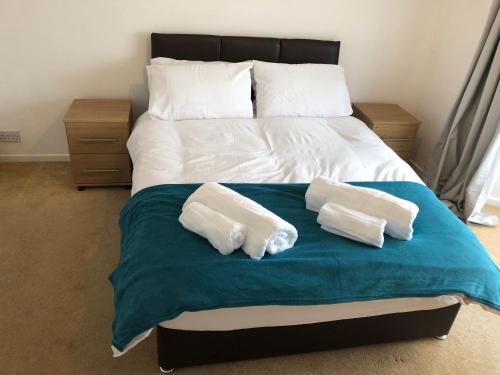 a bed with two pillows on top of it at Jo's Rest in Birmingham