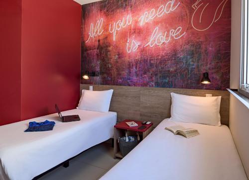 מיטה או מיטות בחדר ב-ibis Styles Franca
