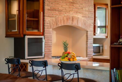 a kitchen with a bowl of fruit on a counter at Velero Beach Resort in Cabarete