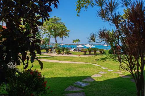 a park with the beach in the background at Velero Beach Resort in Cabarete