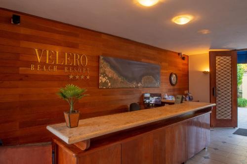 a bar with a sign that reads welcome black ranger at Velero Beach Resort in Cabarete