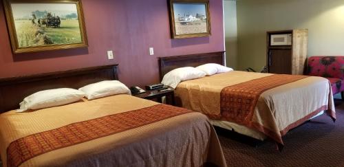 Ένα ή περισσότερα κρεβάτια σε δωμάτιο στο Classic Inn Lancaster