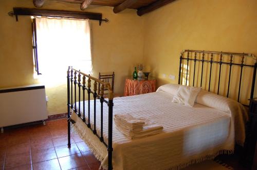 Tempat tidur dalam kamar di La Jara De Las Villuercas