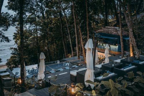 an outdoor wedding with umbrellas and a restaurant at The Culvert in Kuching