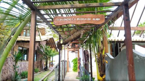 a building with a sign that reads okefenokee af american museum at Pontal dos Sonhos- Chalés Praia do Farol in Coruripe