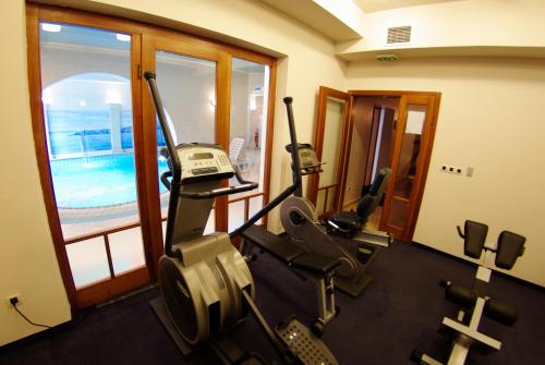 a gym with cardio equipment in a hotel room at Hotel Villa Marija in Tučepi