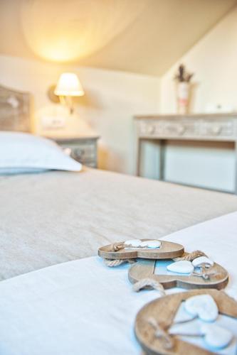 two pairs of flip flops sitting on a bed at Chalet Hovel in Mănăstirea Humorului