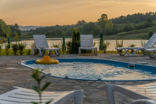 a group of chairs and a pool with a toy in it at Palitsi Dam Complex in Palitsi