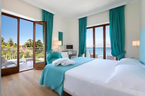 Postel nebo postele na pokoji v ubytování Boutique Hotel Regina