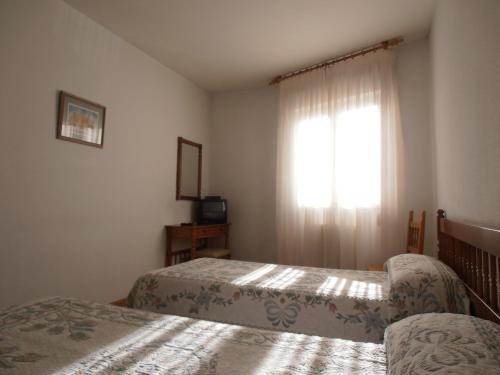 Cama o camas de una habitación en Hostal ** EC León