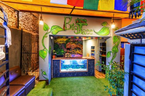 a room with a large fish tank in a aquarium at Big Tree Hostel in Kathmandu
