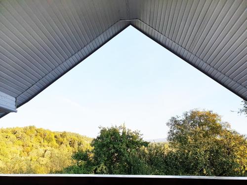 a view from the inside of a building with trees at Popas in Breb in Breb