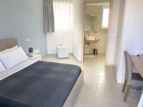 Postel nebo postele na pokoji v ubytování Assteas Rooms