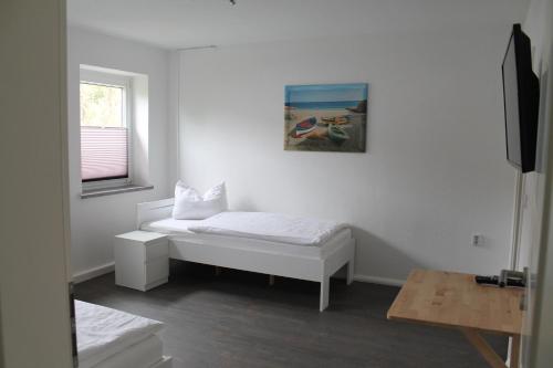 Ein Bett oder Betten in einem Zimmer der Unterkunft SchlafSchön Apartments+Monteurzimmer