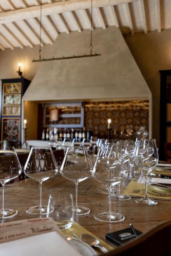 a group of wine glasses sitting on a table at Casanova di Neri Relais in Montalcino