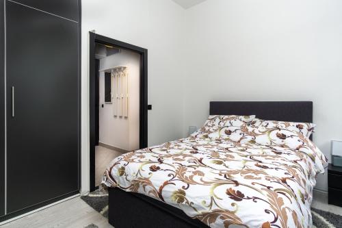 Postel nebo postele na pokoji v ubytování Apartman Ambasador Zagreb