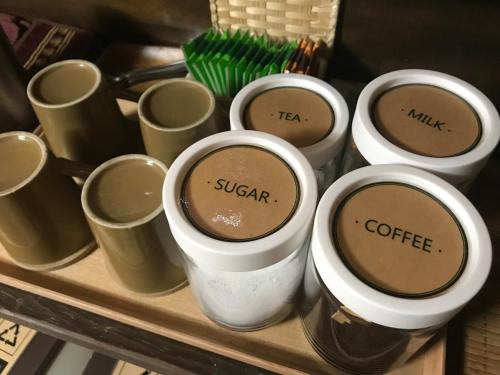 a group of coffee cups sitting on a table at Guest House Hitsujian in Kyoto