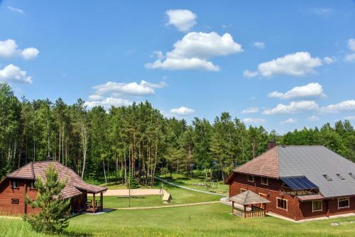 an image of two barns in a park at Sodyba Tundra in Nastazavas