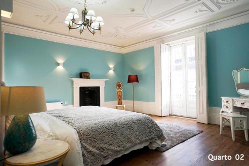 a bedroom with a bed and a fireplace at Santa Catarina Guest House (Porto city center) in Porto