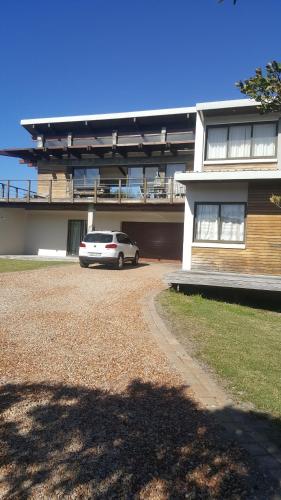a car parked in front of a building at 91 Da Gama Beach House in Cape St Francis
