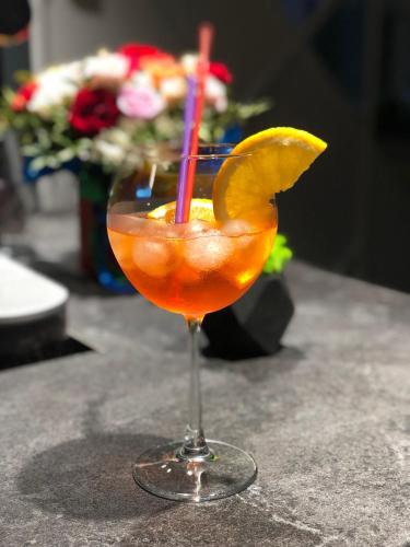 a drink with two straws in a glass on a table at Motel Kurortnyy & SPA in Shklo