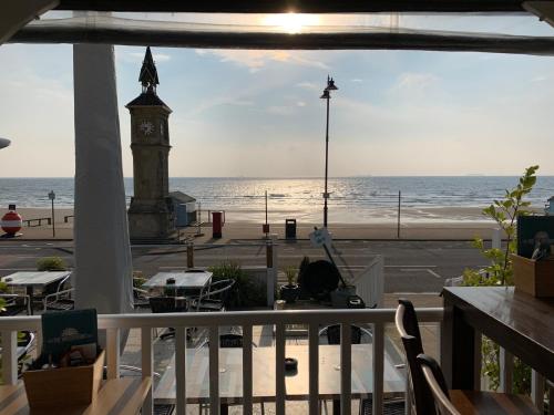 a view of the ocean and a clock tower at Waterfront Inn in Shanklin