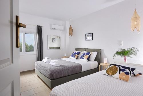 Ένα ή περισσότερα κρεβάτια σε δωμάτιο στο Nakou Village