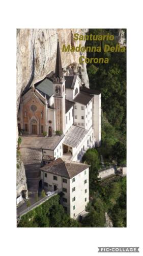 a picture of a church with a mountain in the background at LULLABY HOUSE LAZISE in Lazise